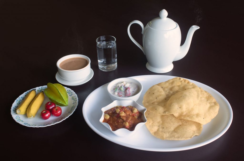 Batura, Bhatura, Batoora, Pathora, Bhatoora with Chole or Chola with a hot cup of tea at Sharanyam Homestay